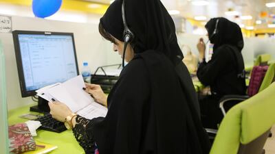 Emirati women work at the Etihad Contact Centre in Al Ain. Sarah Dea / The National