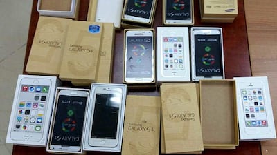 Some of the 60,000 counterfeit mobile phones seized by the Dubai Police over two weeks. If genuine, the handsets would have had a total value of Dh48 million. Courtesy Dubai Police