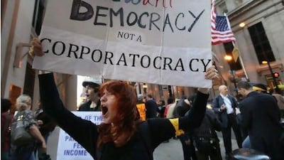 A protest outside the Federal Reserve Bank in Chicago against alleged greed and corruption among banking and business leaders. Scott Olson / Getty Images / AFP