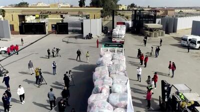 Aid lorries enter the Gaza Strip through the Rafah crossing on Sunday. AP
