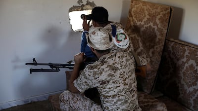 FILE PHOTO: Members of the Libyan internationally recognised government forces take their positions in Ain Zara, Tripoli, Libya October 14, 2019. Picture taken October 14, 2019. REUTERS/Ismail Zitouny/File Photo