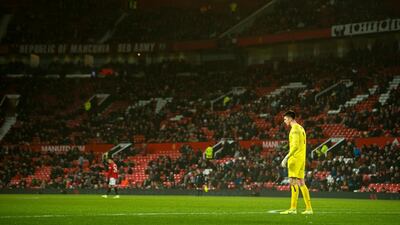 Burnley goalkeeper Nick Pope in front of empty seats at Old Trafford. EPA