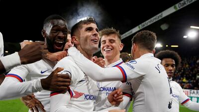 Christian Pulisic celebrates with Chelsea teammates after completing his hat-trick at Burnley. Reuters