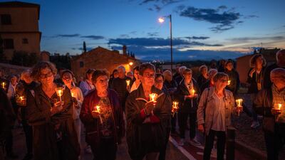 Local residents holding candles take part in a procession asking for rain in Perelada, a rural village in the northeast of Catalonia, Girona, Spain, on April 27. AP