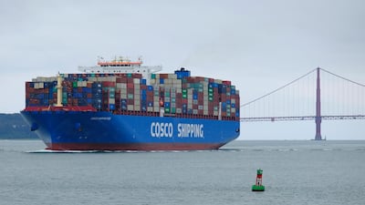 A Cosco Shipping container ship passes the Golden Gate Bridge in San Francisco. The US and China recorded flat inflows of foreign investments in 2019 when they were locked in a trade war. AP.