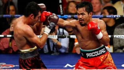 Manny Pacquiao of the Philippines connects with a right to the head of Oscar De La Hoya during their welterweight fight in Las Vegas.