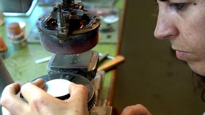 A watchmaker works on the dial of a timepiece. Courtesy Atelier Laurent Ferrier
