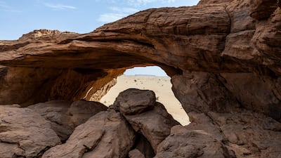A general view of the top of a cave at the Garoa Hallagana rock art site, in Ennedi Ouest province, Chad, on July 10, 2025. A five-day scientific mission, conducted at the end of July, thirty kilometers from Fada, brought together Chadian archaeologists and geologists from the universities of N'Djamena and Abeche. The objective: to lay "the first milestone" in the chronological markers of the ancient occupation of the Ennedi region, the researcher asserts. The Ennedi Natural and Cultural Reserve (RNCE), created in 2018 in this Chadian province, at the crossroads with Libya and Sudan, is home to a rich archaeological heritage. Across a sanctuary spanning more than 50,000 square kilometers, tens of thousands of rock engravings and paintings adorn the rock faces. Following the inscription of the RNCE on the World Heritage List in 2016, the Chadian government entrusted its co-management to the South African NGO African Parks for fifteen years. (Photo by Joris Bolomey / AFP)