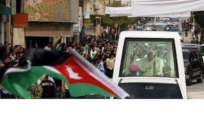 The book devotes a section to Pope Benedict XVI, seen above during a visit to Madaba, Jordan last year.Patrick Baz / AFP