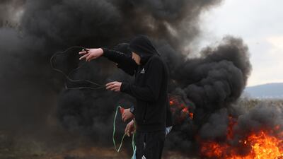 epa09747201 Palestinian protesters clash with Israeli forces during a demonstration against Israel's settlements on the lands of Beita village, near the West Bank city of Nablus. EPA
