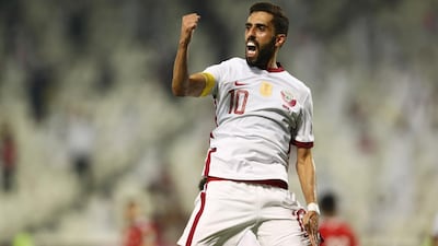 Qatar's Hassan Al Haydos celebrates scoring the goal.