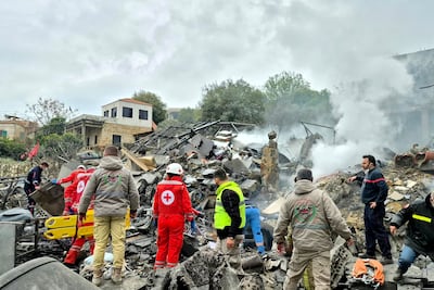 First aid responders work at the site of an Israeli airstrike in the southern Lebanese village of Kfar Roummane on March 26, 2026. AFP