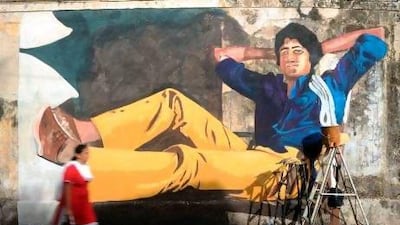 A mural of Amitabh Bachchan. Indranil Mukherjee / AFP