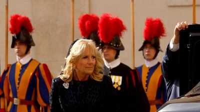 Jill Biden, wearing a matching navy dress and blazer, arrives at the San Damaso Courtyard for a meeting with Pope Francis on October 29, 2021 in Vatican City. Getty Images