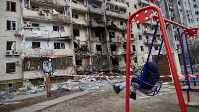 Life goes on outside a residential building damaged by a missile in Kyiv in 2022. Getty Images