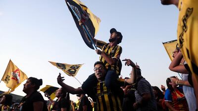 Festival goers wave flags during the World of Music, Arts and Dance festival in Santiago, Chile. EPA