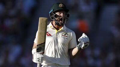 AUstralian batsman Matthew Wade celebrates after reaching his century . Getty