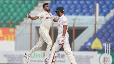 India's Mohammed Siraj, left celebrates the wicket of Bangladesh's Najmul Hossain Shanto during the second day of the first test cricket match between Bangladesh and India in Chattogram, Bangladesh, Thursday, Dec. 15, 2022. (AP Photo / Surjeet Yadav)