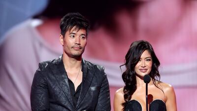 From left to right: Kevin Kreider and Kim Lee speak onstage. Getty Images / AFP