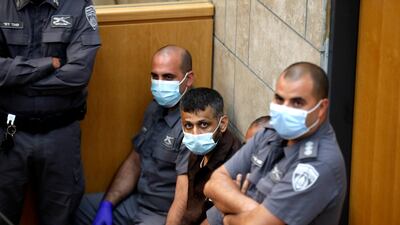 Mahmoud Aradeh, centre, inside a court in Nazareth. Six Palestinians tunnelled out of the Gilboa prison on September 6, setting off a furious manhunt across Israel and the West Bank. EPA