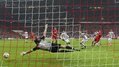 Thiago Alcantara of (2nd R) Bayern Munich scores his team’s third goal past Gianluigi Buffon of Juventus during the Uefa Champions League round of 16, second Leg match between FC Bayern Munich and Juventus at the Allianz Arena on March 16, 2016 in Munich, Germany. (Photo by Alexander Hassenstein/Bongarts/Getty Images)