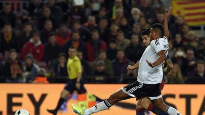 Luis Suarez shoots to score. Lluis Gene / AFP