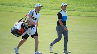 Rory McIlroy of Northern Ireland with his caddie Niall OConnor on the 12th hole at the Jumeirah Golf Estates. Getty Images