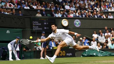 Novak Djokovic stretches to make a return. EPA