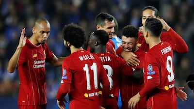 Alex Oxlade-Chamberlain celebrates with teammates after scoring the second goal against Genk. Reuters