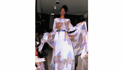 FILE - The Spring Summer high fashion collection by Japanese designer Hanae Mori is modeled, Jan. 9, 1978, in Paris. Mori, a Japanese fashion designer known for her elegant signature butterfly motifs, has died, according to local media reports. She was 96. (AP Photo, File)