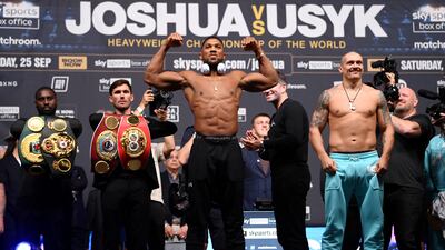 Anthony Joshua and Oleksandr Usyk pose following their weigh in ahead of the heavyweight title fightat Cineworld 02 Arena on September 24, 2021 in London, England. Getty Images