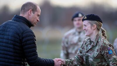 Prince William shakes hands with a soldier. EPA