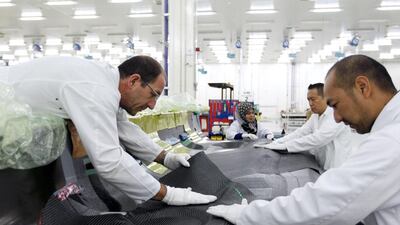 Clean-room operators at Strata’s aerostructures plant in Al Ain. Of its 700-strong workforce, half are Emirati. Jumana El Heloueh / Reuters