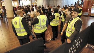 Security on duty at Dubai Mall in Dubai. Pawan Singh / The National