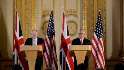 Britain's Foreign Secretary Boris Johnson, left and US Secretary of State Rex Tillerson hold a press conference after their meeting on Libya at Lancaster House in London.