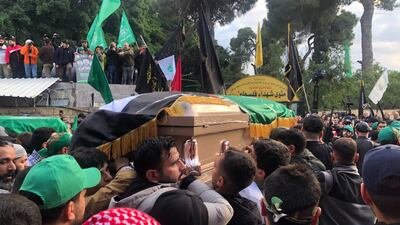 The funeral procession for Mr Al Arouri and others killed in the strike. Nada Atallah / The National