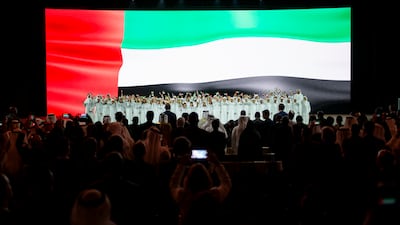 The UAE flag is displayed on screen during the award ceremony