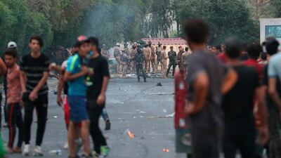 Iraqi security forces prevent anti-government protesters from going to the site of protests in Baghdad, Iraq. AP Photo