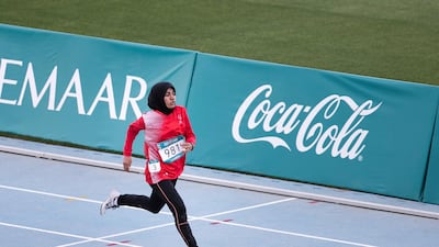 Hamda Al Hosani wins first place at the 200m run at the Special Olympics World Games athletics competition in Dubai Police Academy Stadium. Reem Mohammed / The National