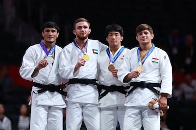 Kazbek Naguchev, second left, won gold in the men's judo -73kg category. Reuters