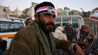 Armed members of the Houthi militia ride in the back of a truck as part of security measures guarding a rally commemorating the fourth anniversary of the 2011 uprising and celebrating the Houthis takeover in Sana’a, Yemen. Yahya Arhab / EPA