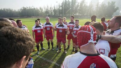 RAK Rugby huddle before their match