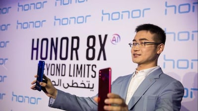 Chris Sunbaigong, president of Honor MEA, during the launch of the new 8X smartphone in Dubai. The National