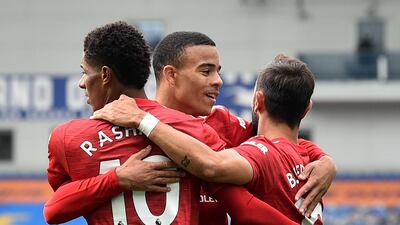 Manchester United's Marcus Rashford celebrates scoring their second goal with Bruno Fernandes and Mason Greenwood. Reuters
