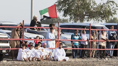 People from children to adults watching bull fighting in Fujairah corniche.
