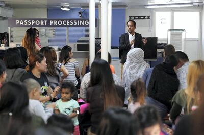 Social worker Arthur Blais gives advice to unwed mothers at the Philippine consulate in Dubai. Pawan Singh / The National
