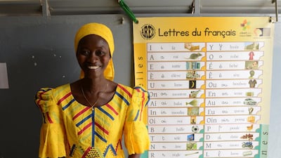 Ms Ndiaye Diouf stands next to one of the several hundred publications and teaching materials printed by ARED to help students learn French in a language where the majority of official work is conducted in the lingua Franca. Naser Al Wasmi / The National