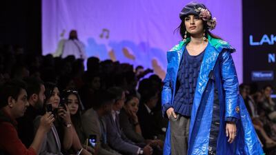 Aneeth Arora did a number of colourful headpieces and shrug-on jackets . EPA