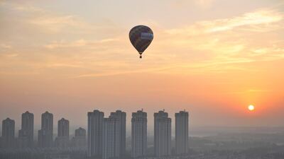 A hot air balloon flies over Wuqing District of Tianjin, China. The country's economic performance has boosted yuan trading. Reuters