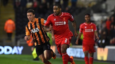 Liverpool's Glen Johnson dribbles the ball against Hull City during his side's Premier League loss on Tuesday. Paul Ellis / AFP / April 28, 2015